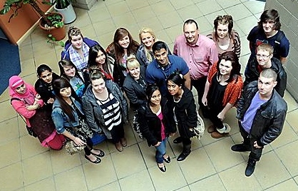 SMART ENTERTAINMENT . . . the stars of Oldham Sixth Form College’s revision video with sociology lecturers Claire Corrigan and Salim Rahman (centre) 

