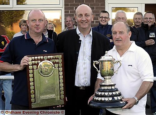 TOP TWO . . . Runner-up Darren Griffiths (left) and winner Brian Raynor (right) are congratulated by Chronicle editor Dave Whaley after receiving their prizes following the Oldham Evening Chronicle Handicap bowling trophy final at North Chadderton Bowling Club. PICTURE - CHRIS SUNDERLAND. 