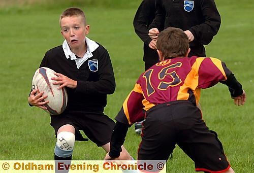 COMING THROUGH: Joe Rathmill of Oasis tries to pick his way between a pair of tacklers in the sevens tournament. COMING THROUGH: Joe Rathmill of Oasis tries to pick his way between a pair of tacklers in the sevens tournament.
