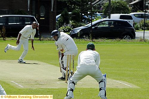 DEATH RATTLE . . . Heyside’s Ben Holt is bowled for 26 by Glodwick’s Imran Asghar. 