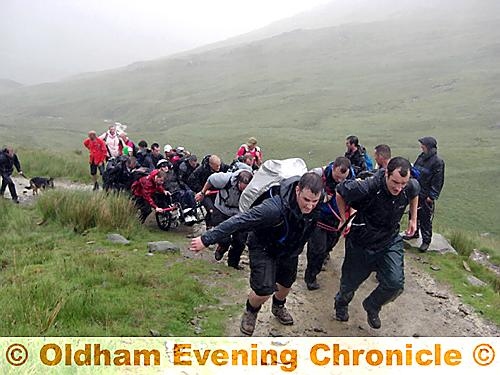 CLIMBING high... Andy Walker and his team trek up Mount Helvellyn. 
