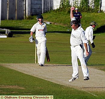 MOMENT OF TRIUMPH . . . evergreen John Punchard celebrates after taking the final Walsden wicket, Martin Harlow, superbly caught at slip by Chris Hutchinson. 


