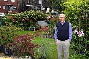 Edward Butterworth, from Wimberry Close in Greenfield, proudly shows off his colourful and eye-catching garden displays 