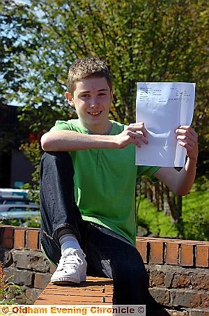 A-STAR: Daniel McLoughlin (13) with his A* GCSE result in maths A-STAR: Daniel McLoughlin (13) with his A* GCSE result in maths