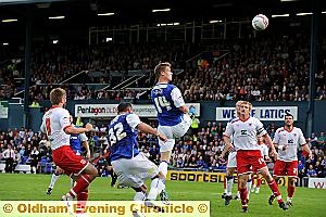 CHANCE GOES BEGGING: Matt Smith strains to get in a header on goal with Shefki Kuqi right behind him and in a better position to score. 

