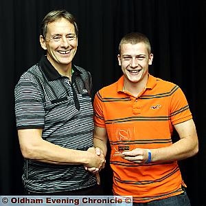 FOR PEET’S SAKE: Danny Peet (right) is congratulated on his outstanding efforts by Scholarship squad coach Phil Costin.
FOR PEET’S SAKE: Danny Peet (right) is congratulated on his outstanding efforts by Scholarship squad coach Phil Costin.