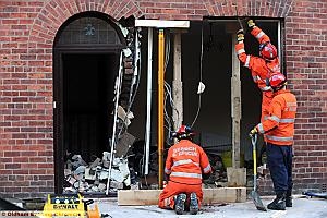 Scene of devastation on Brown Street, Failsworth. A car earlier crashed into the house. 