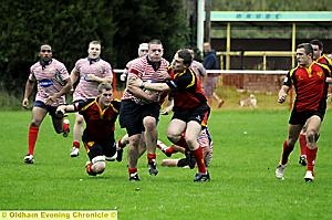 SHUT-EYE: Oldham's John Souter tries to force his way through a tackle SHUT-EYE: Oldham's John Souter tries to force his way through a tackle