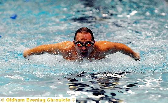MASTER STROKE. . . . Jamie Kelly scythes through the water.