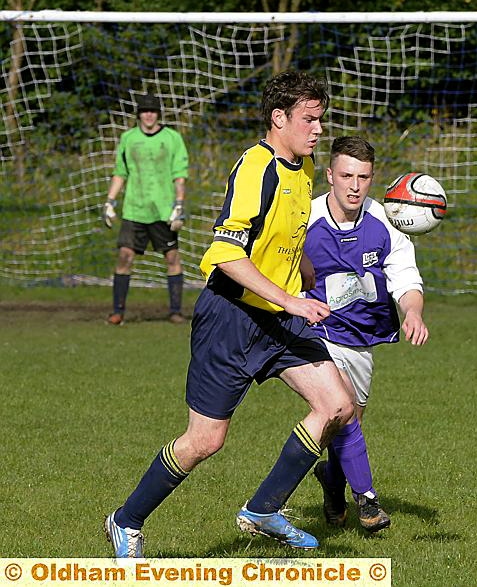 Dynamos' Mark Perry (in yellow) tussles with Cowcliffe's Jamie Sanderson Dynamos' Mark Perry (in yellow) tussles with Cowcliffe's Jamie Sanderson