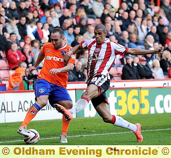 WING WIZARD . . . Lee Croft displays his trickery against Nick Blackman. 