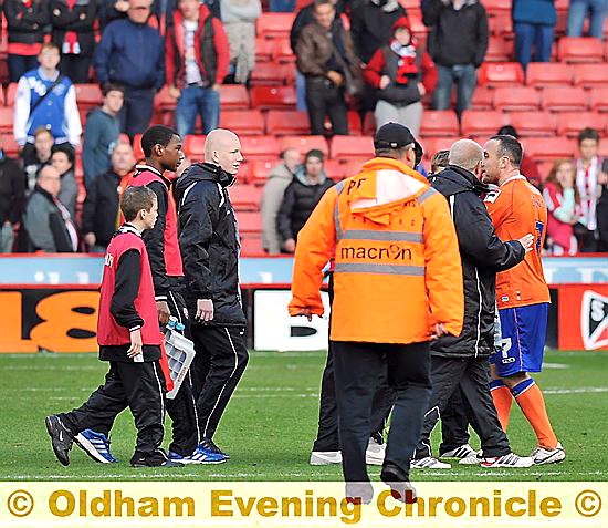 ATHLETIC player Lee Croft (far right) apologises to the ballboy at the end of the Sheffield game.
ATHLETIC player Lee Croft (far right) apologises to the ballboy at the end of the Sheffield game.