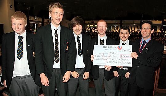 The school raised more than £3,600 for the Young Oncology Unit in Manchester. Year 11 pupils (from the left) Danny Fielding, Bradley Wright-Chapman, Harry Whittaker, Matthew Bullock and Thomas Harrison presented the cheque at a leavers’ assembly earlier this year to Howard Newhall from the Christie Hospital 
