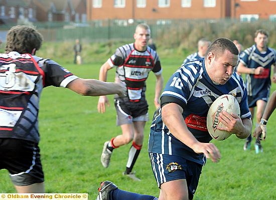 TRY TIME . . . Hollinwood’s Pete Jackson sprints for the line. 