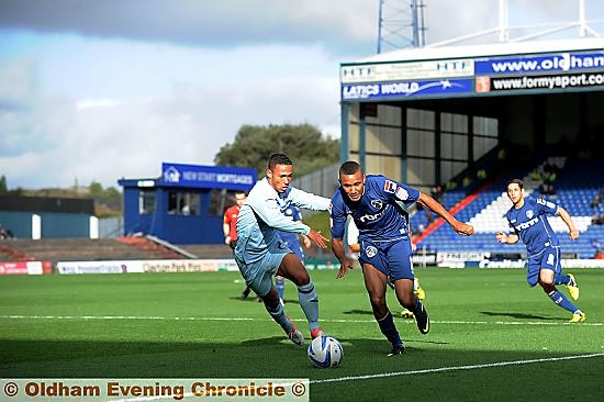 RUNNING GAME: Cristian Montano takes on Coventry’s Jordan Clarke on the outside. 