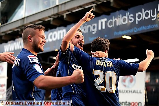 PLENTY TO SMILE ABOUT: Matt Derbyshire joins in the celebrations after Jose Baxter doubles Athletic’s lead. 