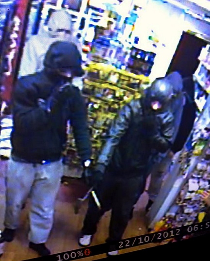 THREAT: one of the hooded men with a knife 
