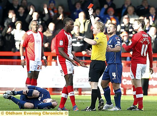 Seeing red: Crawley’s Hope Akpan is sent off by referee Gavin Ward for bringing down Athletic’s Robbie Simpson. Seeing red: Crawley’s Hope Akpan is sent off by referee Gavin Ward for bringing down Athletic’s Robbie Simpson.