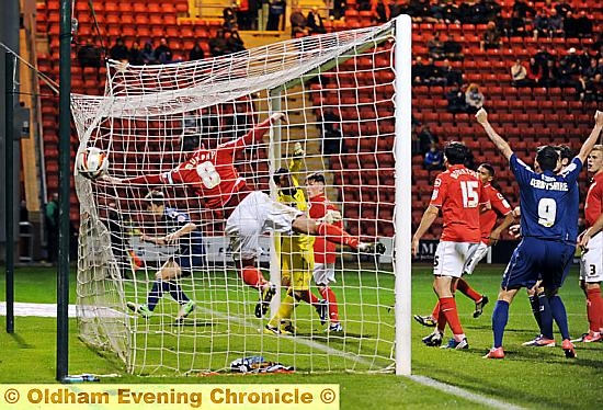 NET BUSTER: James Tarkowski (left) wheels away after putting Athletic in front last night. 