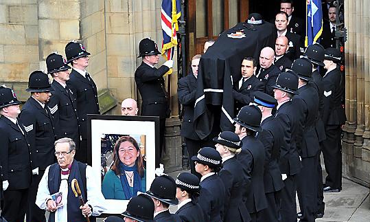 The coffin of Pc Fiona Bone is carried from Manchester Cathedral following her funeral service. 