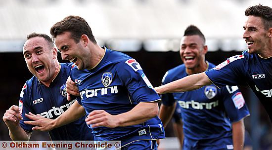 MAGIC MOMENT: Baxter celebrates his goal with his ecstatic team-mates. 