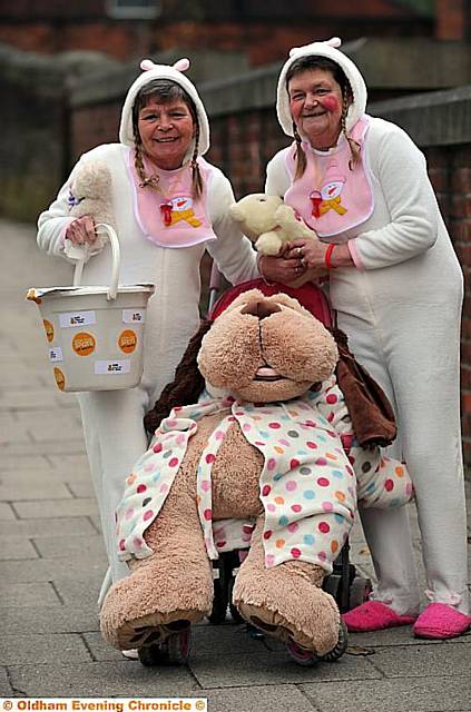 Ann Taylor and Pat Grice. dressed as babies on Oldham Road, Failsworth raising money for Children in Need.  

