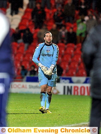 OFF YOU GO . . . Dean Bouzanis walks after his dismissal 