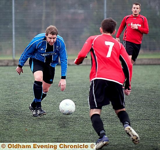 CAGEY: Michael Ward, of Heyside, plots a way past a Britannia Sports counterpart. CAGEY: Michael Ward, of Heyside, plots a way past a Britannia Sports counterpart.
