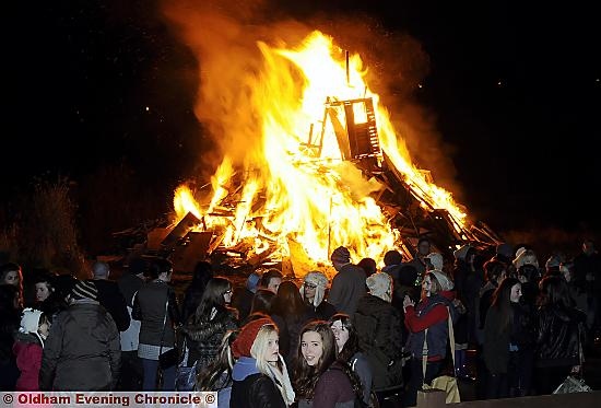 KEEPING warm by the Shaw bonfire  

