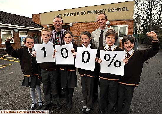 CONTINUED SUCCESS... St Joseph’s head teacher Andy Dickinson (left) with year 6 teacher and deputy head Steve Hill and pupils (from left) Elanor Curley, Jack Whitworth, Abbie Spencer, Emily Lynch, Peter Milligan and Niall Kelly.  


