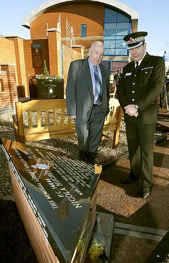 Officers pay their respects at the memorial garden