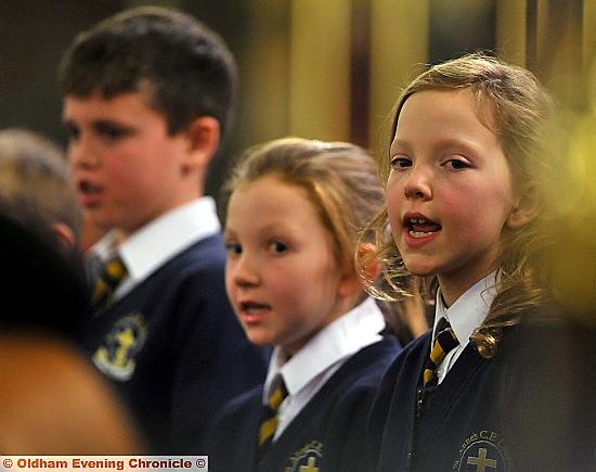 IN tune: Ella Dibden (right) with St Anne's CE School choir, Lydgate 
