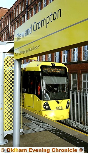 THE TRAM NOW ARRIVING: the first tram stops at the new Shaw and Crompton station. 