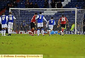 LAST-GASP SAVER: Alex Cisak clinches victory for Athletic with his stoppage-time dive 