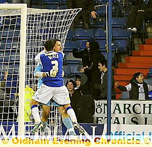 LAST-GASP HERO: Athletic goalkeeper Alex Cisak celebrates with team-mate Paul Black after his dramatic penalty save. 