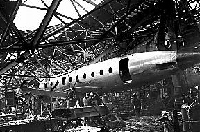 A NUMBER of aircraft under construction were damaged, not only by the fire but by girders, which fell on to the fuselage as the roof collapsed. 

