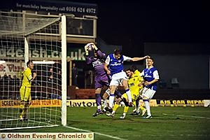 THICK OF THE ACTION: James Tarkowski puts pressure on Colchester goalkeeper Ben Williams. 