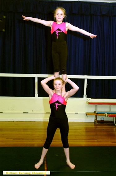 REACHING FOR THE SKY; Lucy Tindall (top) and Grace. Kenney-Tindall will take on the best gymnasts in the country at the British Schools’ Championships. 
