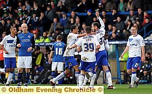 SWEET AND SOUR . . . Shefki Kuqi celebrates his wonder goal 