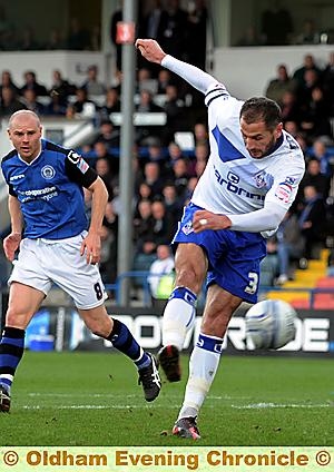 Shefki Kuqi unleashes a shot against Rochdale. Shefki Kuqi unleashes a shot against Rochdale.