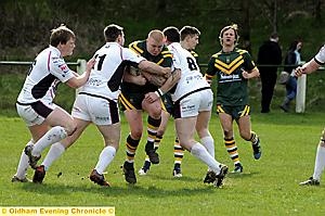 MAKE WAY . . . Carl Fields, of St Oldham Anne’s, attempts to smash his way through the Castleford Panthers line. MAKE WAY . . . Carl Fields, of St Oldham Anne’s, attempts to smash his way through the Castleford Panthers line.