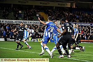 FOX IN THE BOX: Jean-Yves Mvoto (left) shows a striker’s instinct to give Athletic a lead they never surrendered. 