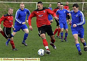 CLOSE CONTROL . . . Springhead's Paul Stevenson is on the ball as Paul Caton (right), of East Manchester, closes in during the Gilgryst Cup semi-final clash. CLOSE CONTROL . . . Springhead's Paul Stevenson is on the ball as Paul Caton (right), of East Manchester, closes in during the Gilgryst Cup semi-final clash.