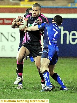 HELD UP: Oldham’s Miles Greenwood is tackled 