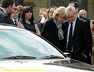 HEART-WRENCHING: Mr McManus’s parents Laura and Mike as their son’s coffin is led away 