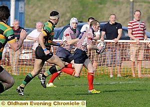 GO, Gorey, go: Oldham’s Andy Goreysprints towards the Littleborough line. 
