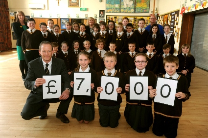 WE did it! Deputy head Steve Hill with pupils Ellie Mellor, Ethan Kershaw, Hannah Hilton and Lewis Varley with fellow pupils at St Joseph’s 
