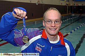 SILVER SHOW . . . Ben Procter shows off his medal from the 200 metres freestyle final at the British Championships. SILVER SHOW . . . Ben Procter shows off his medal from the 200 metres freestyle final at the British Championships.