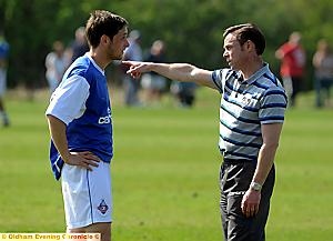 POINTING THE WAY: boss Paul Dickov and Dean Furman chat during this week’s reserve-team game. 