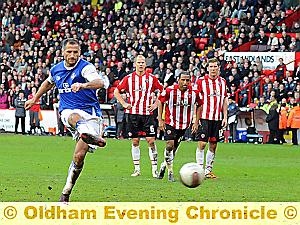 SPOT-ON SHEFKI . . . back-to-form Athletic striker Kuqi keeps his cool from the penalty spot to clinch an amazing victory. 
